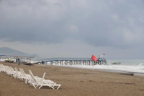 Storm on a sandy beach on a cloudy, rainy evening, mediterranean sea, peace.. Stock Photos