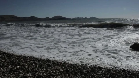 Storm on the sea against the background of mountains Stock Footage