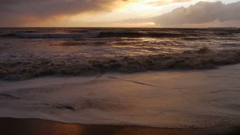 Storm in the sea, big waves crashes on the beach in sunset Stock Footage 70830645