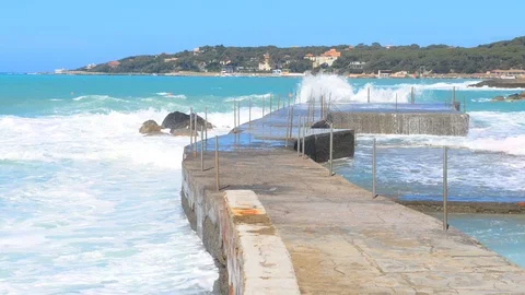 Storm on the sea. Big waves. View from the pier. Blue sky and sea. Stock Footage 108798284