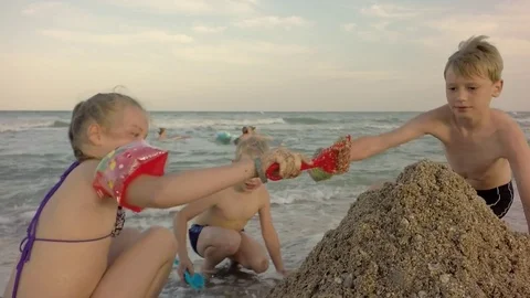 Storm on the sea. Cloudy sky. Sand Toys On The Beach. Children build sand. 库存影片 84264882