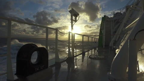 Storm at sea. Deck of ship and handrails are splashed by waves. Pitching. Rays Stock Footage 242062149