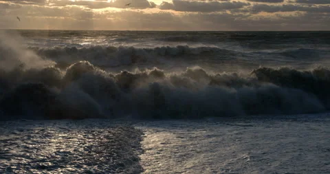 Storm at sea. High waves in backlight (Contre-jour). High tide (slow motion) Stock Footage 96424869