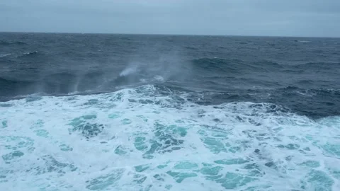 Storm at sea. High waves. Wind blows spray off wave. Side view along ship. Wind Stock Footage 219817001