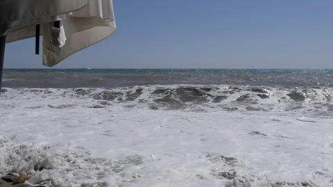 Storm at sea. Large waves break on the sandy beach. Stock Footage 116859524