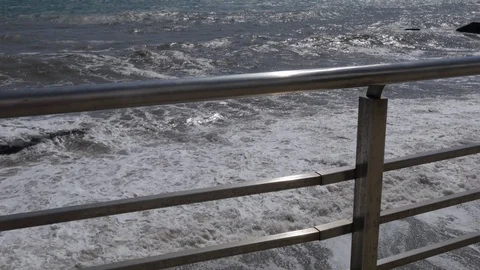 Storm at sea. Large waves break on the sandy beach. Stock Footage 117244843