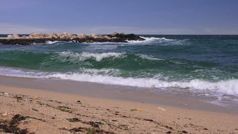 Storm on the sea, large waves roll on the sandy beach Stock Footage 94397224