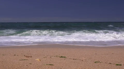 Storm on the sea, large waves roll on the sandy beach Stock-Footage 94682278