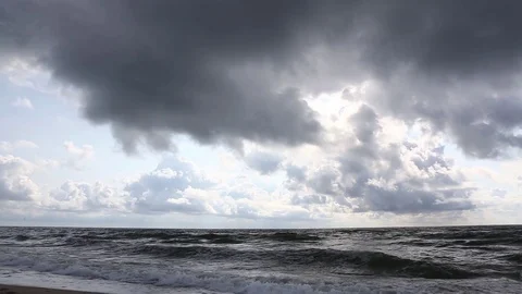 Storm on the sea sandy beach, overcast, the wind chases waves and clouds. Stock Footage 81326344