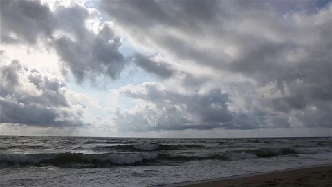Storm on the sea sandy beach, overcast, the wind chases waves and clouds. Stock Footage 81326346