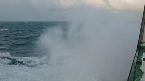 Storm at sea. Side view from ship low on water. Splashes from bow of vessel Stock Footage 294982399