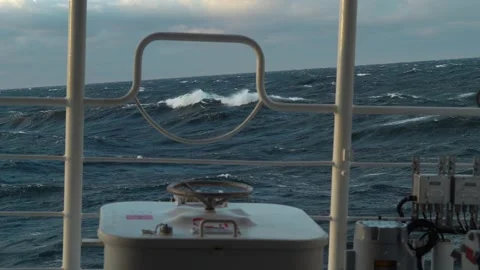 Storm at sea. Side view from vessel low over the water. Railing and manhole on Stock Footage 260472109
