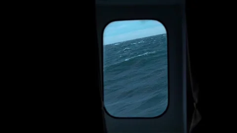 Storm at sea. View through cabin window. Strong pitching. Curtains tilt. High Stock Footage 242041196