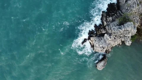 Storm at sea. View from the top. Blue Sea. Rocks and huge waves. Waterblow Nusa Stock Footage 190952269