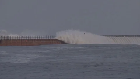 STORM AT SEA - Waves over the pier Stock Footage 71398714
