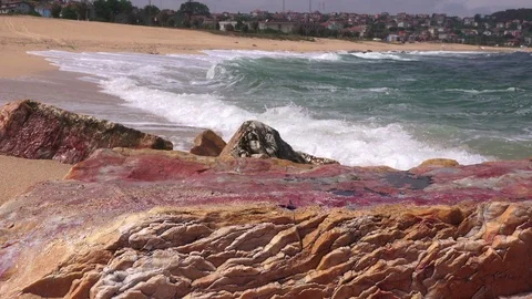 Storm on the sea,  waves roll on the sand and break on the rocks Stock Footage 90671328