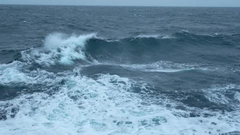 Storm, sea. Wind breaks waves with splashes. White foam on wind. Side view along Stock Footage 240081487
