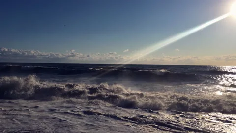 Storm on the seaside. High waves crash on the shore. Seagulls dodge splashing Stock Footage 161140690