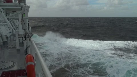 Storm, ship. View from open deck. High waves and splashes along side. White foam Stock Footage 246582515