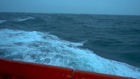 Storm. Side view to the sea from ship low on water. Slow motion high waves and Stock Footage 266260279