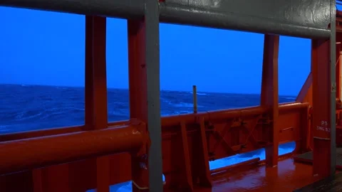 Storm. Side view from ship low over water. High waves and splashes. White foam Stock Footage 220670899
