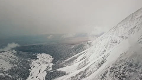 Storm, snowfall in the huge glacier of Mount Belukha, the valley of the Aktru Stock-Footage 163972920