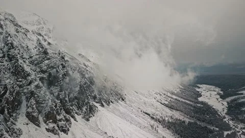 Storm, snowfall in the huge glacier of Mount Belukha, the valley of the Aktru Stock-Footage 163973729