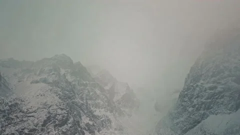 Storm, snowfall in the huge glacier of Mount Belukha, the valley of the Aktru Stock-Footage 164367615