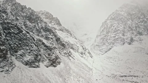 Storm, snowfall in the huge glacier of Mount Belukha, the valley of the Aktru Stock-Footage 164367747