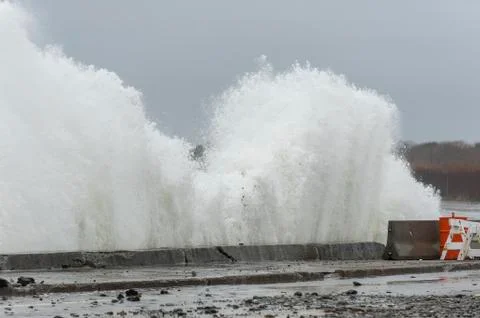 Storm surf battering retaining wall Stock Photos