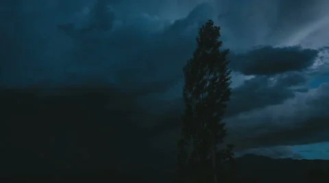 Storm with tree in the foreground Stock Footage 54628702