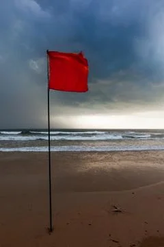 Storm warning flags on beach. Baga, Goa, India Stock Photos