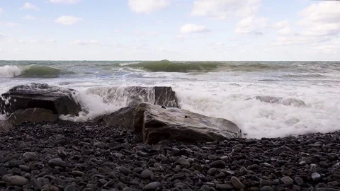 Storm waves break about boulders audio Stock Footage 82615935