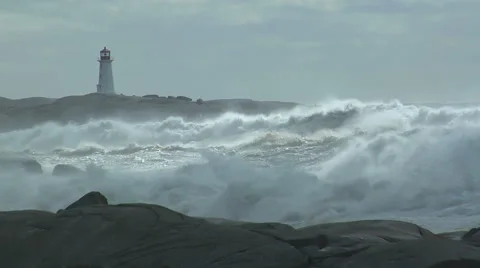 Storm waves breaking against rocks on ocean shoreline Stock Footage