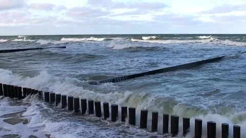 Storm waves breaking on breakwaters, after a hurricane on the coast Stock Footage 168606621