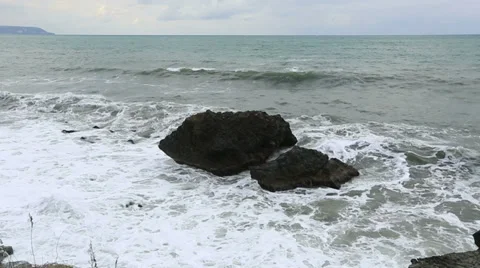 Storm waves crash against the rocks Stock Footage 33548948