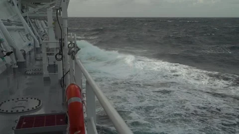 Storm. Waves crash against side of ship. Deck of cargo vessel and high waves Stock Footage 242010880