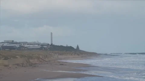 Storm waves hitting sandy beach with visible coastal erosion in Bunbury WA. Stock Footage 340803716