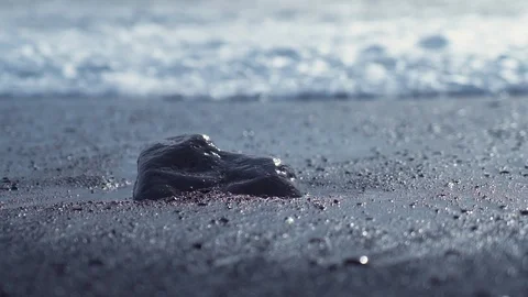 Storm waves stone water slow motion Iceland black beach100 fps Stock Footage 126070657