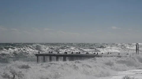 Storm weather, waves breaking on the pier Video stock 68984024