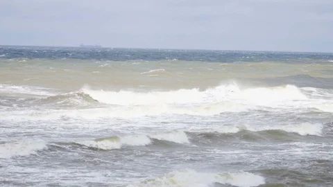 Storm wind raises waves. Hurricane on the sea. Ocean waves storm sea spray. Stock-Footage 77607350