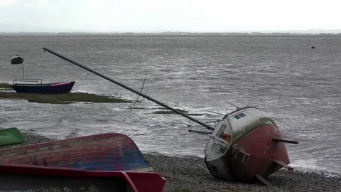 Storm wrecks boats ocean Stock Footage 82575208