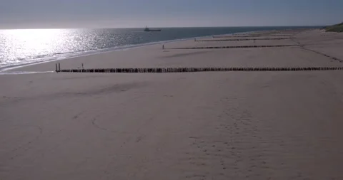 Stormbreakers on the beach in The Netherlands shot with drone Video stock 197563580