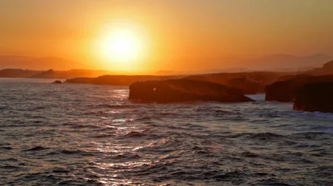Storming waves during inflow at sunset on Playa de las Catedrales, Spain Stock Footage 34962560