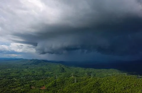 Storms and black clouds moving over the mountains Stock Photos
