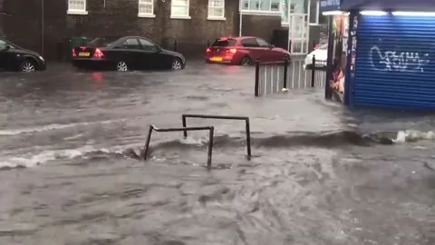 Storms cause flash flooding in London, UK Stock Footage 170451773