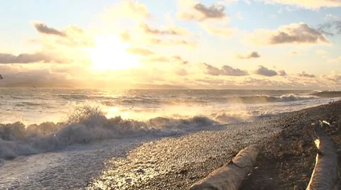 Storm's Passing Beach Sunset - reverse zoom pan Stock Footage