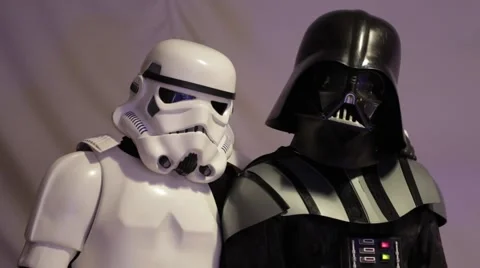 Stormtrooper and Darth Vader posing for a photo shoot. Star Wars. Stock Footage