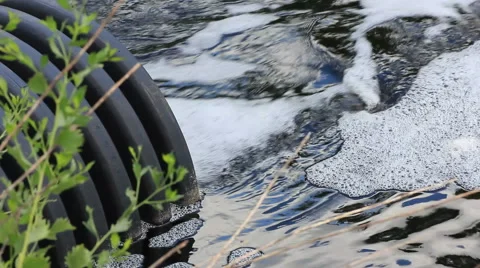 Stormwater quickly exiting from culvert side Stock Footage 43248068