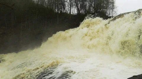 Stormy and powerful waterfall in the forest. Slow motion footage. Stock Footage 102748276